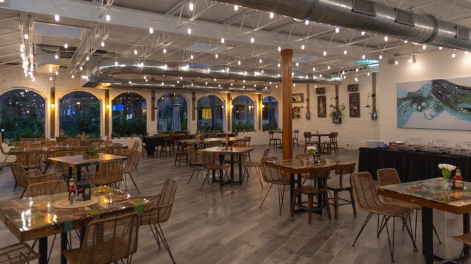 Nineteen66 Restaurant and Bar at the Island by Hotel RL. Dusk photo of interior at hotel restaurant.